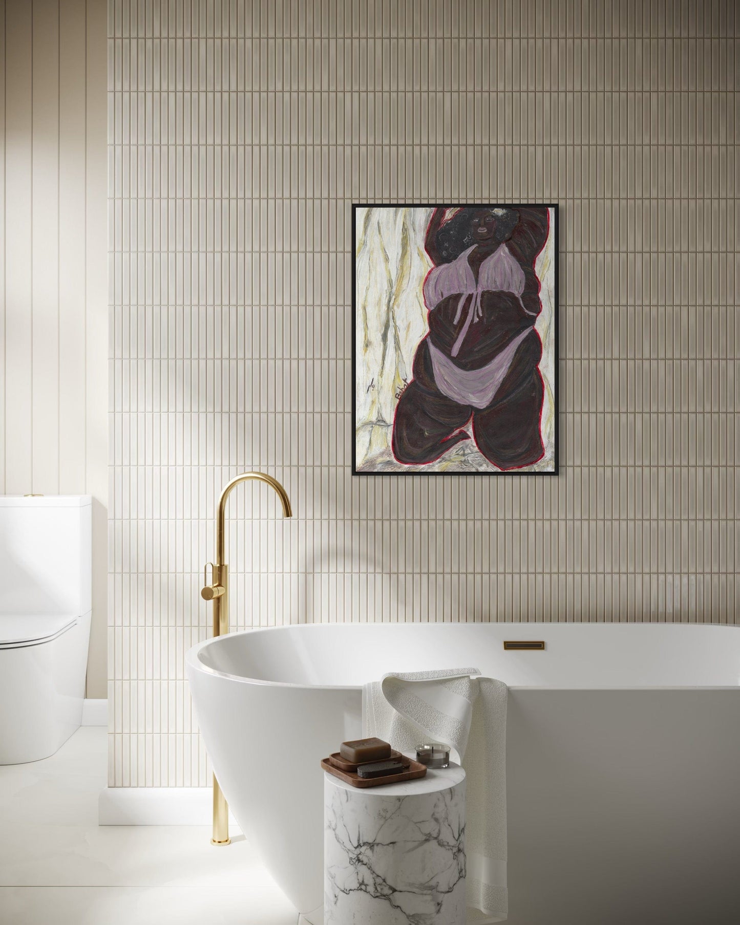 Modern bathroom with freestanding bathtub, gold faucet, and abstract art on the wall.