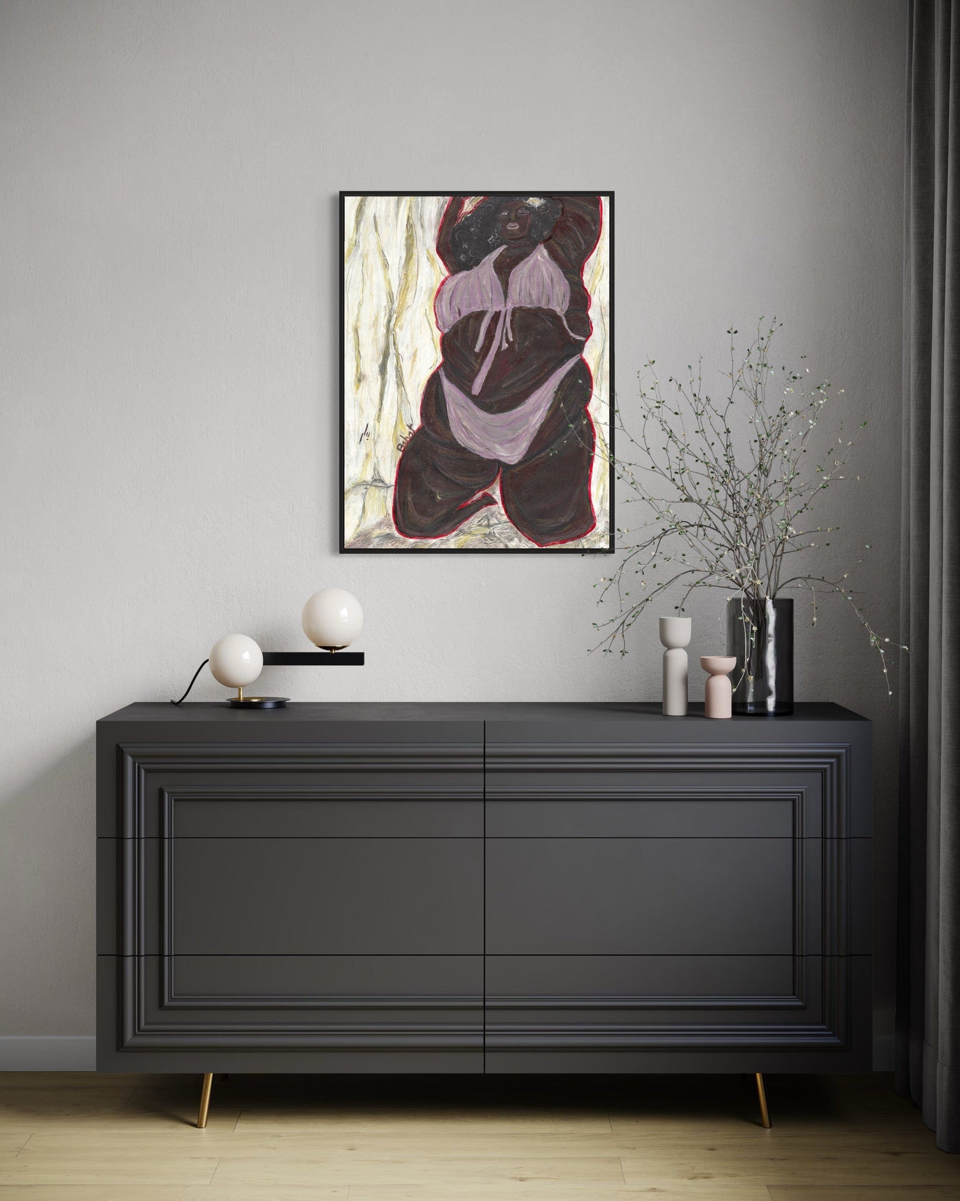 Modern interior with a black dresser, abstract painting, and decorative items.
