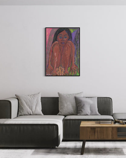 Framed artwork of a woman on a wall above a modern sofa in a living room.