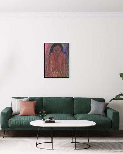 Green sofa with decorative pillows in a living room setting, featuring a painting of a woman on the wall.
