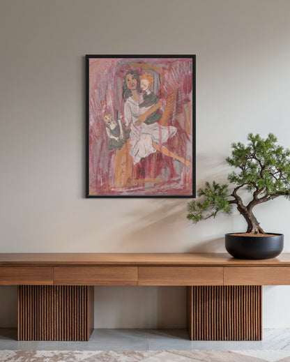 Framed artwork on a wall above a wooden console table with a bonsai tree.
