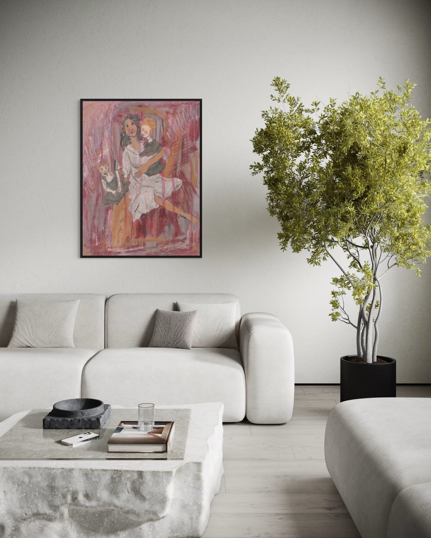 Modern living room with a gray sofa, coffee table, and decorative plant.