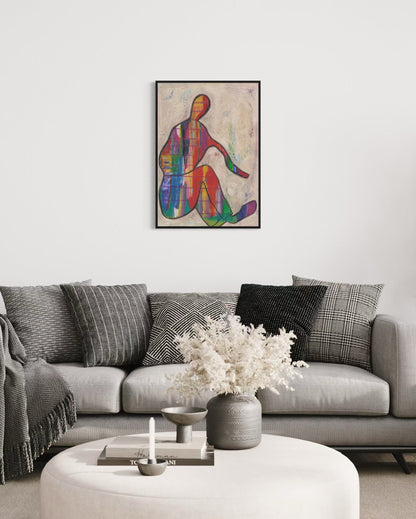 Living room with a gray sofa, colorful abstract art, and decorative items.