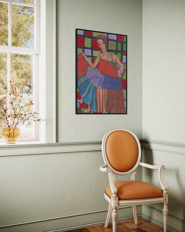 Colorful abstract painting on a wall above an orange chair in a room with a window.
