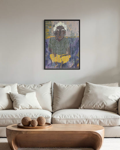 Framed artwork of a person with a white headscarf above a white sofa in a living room.