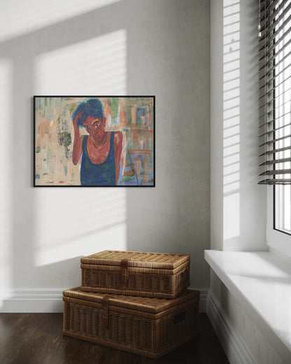 Framed artwork on a wall with wicker storage baskets on the floor below.