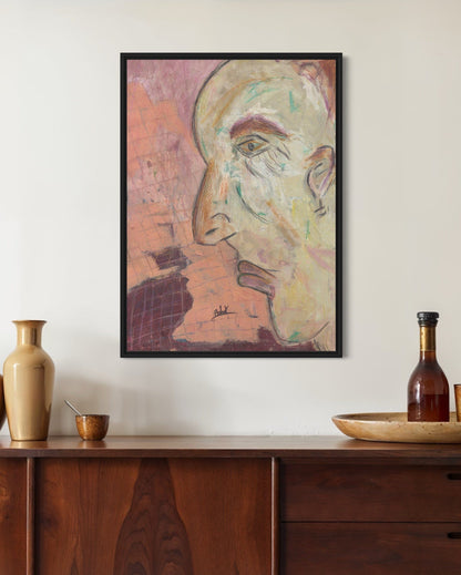 Framed abstract artwork on a wall above a wooden console table with decorative items.