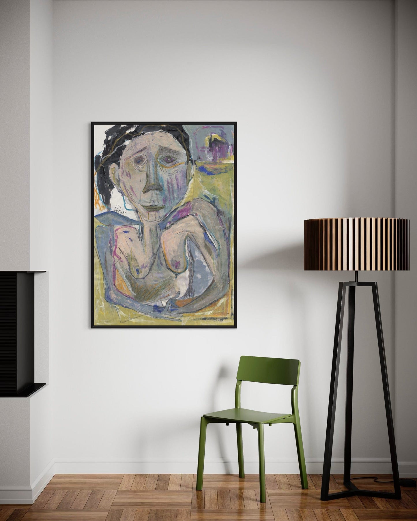 Framed abstract painting on a wall with a green chair and black floor lamp.