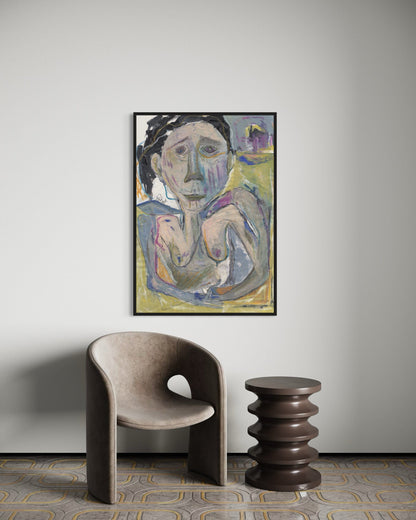 Framed abstract painting on a wall with a modern chair and side table below.
