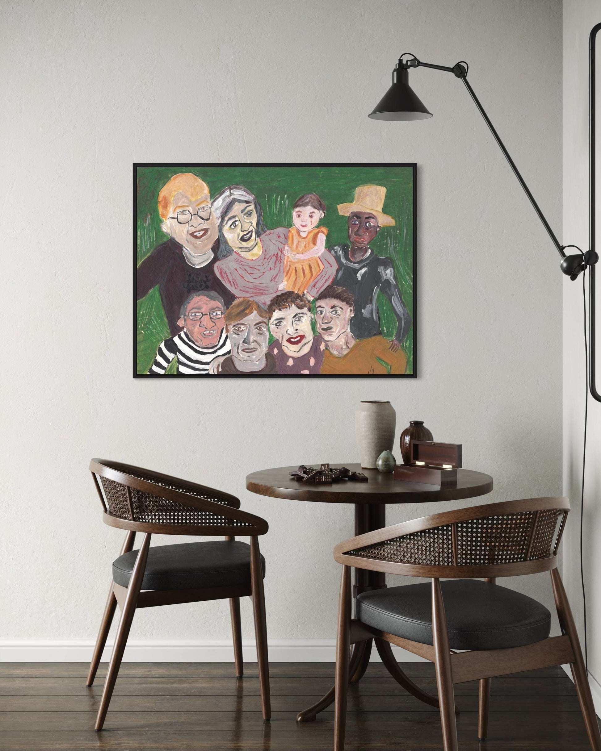 Dining area with a round table and two chairs, featuring a colorful painting on the wall.