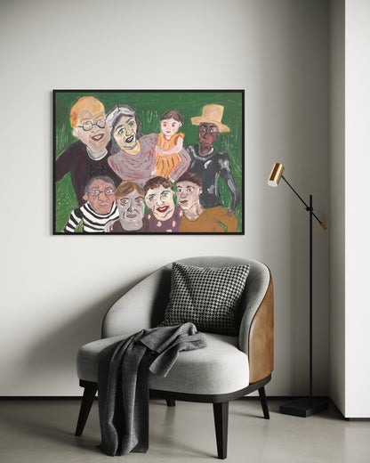 Framed artwork of a family on a wall above a chair with a blanket.