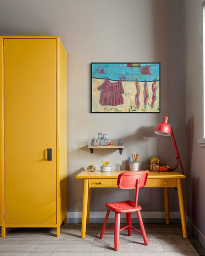 Yellow cabinet, red chair, and desk with a colorful painting on the wall in a room.