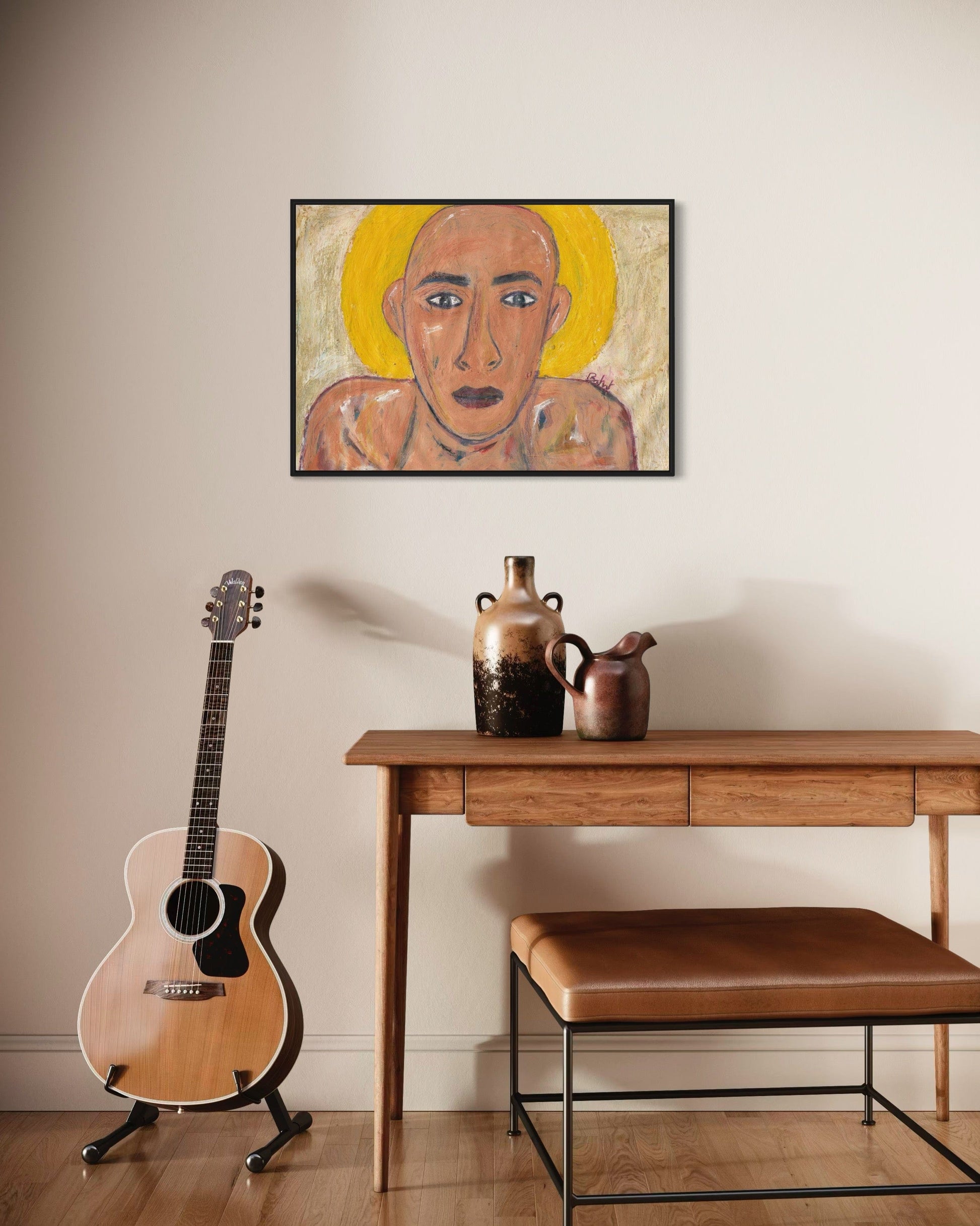 Guitar, wooden table with decorative items, and framed artwork on a wall.
