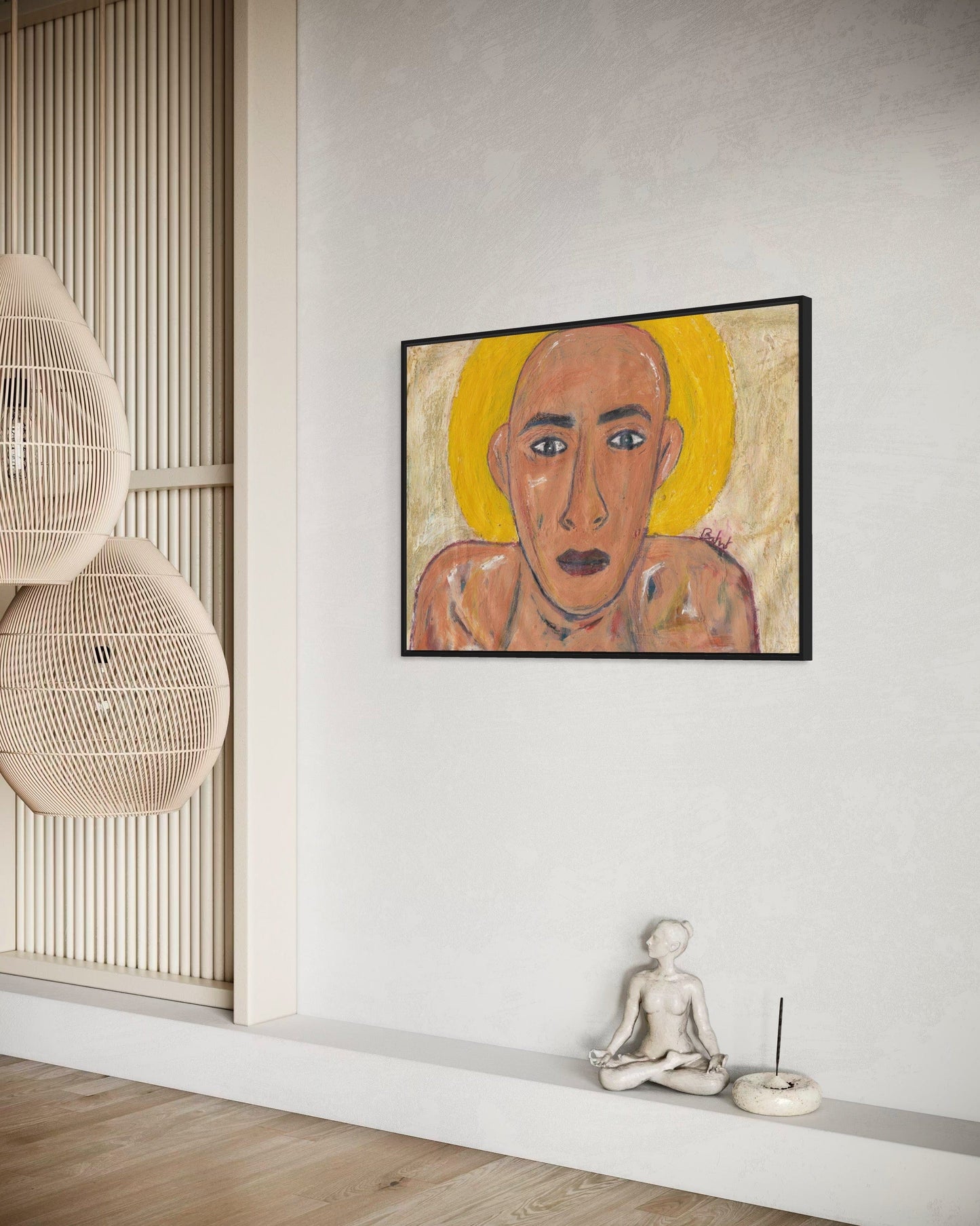 Framed artwork of a stylized portrait on a wall with minimal decor