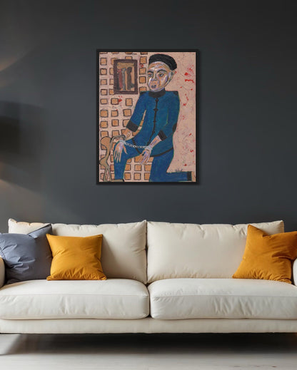 Framed artwork on a dark wall above a white sofa with orange and gray cushions.