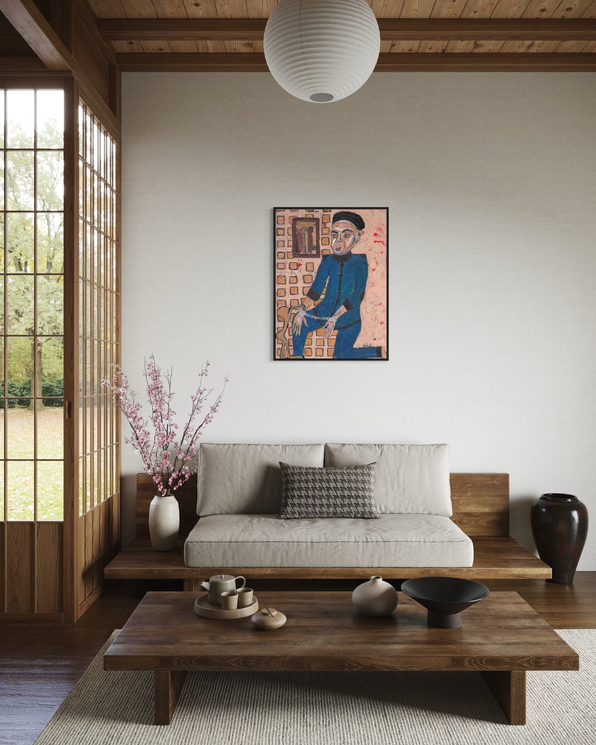Modern living room with a sofa, coffee table, and decorative wall art.