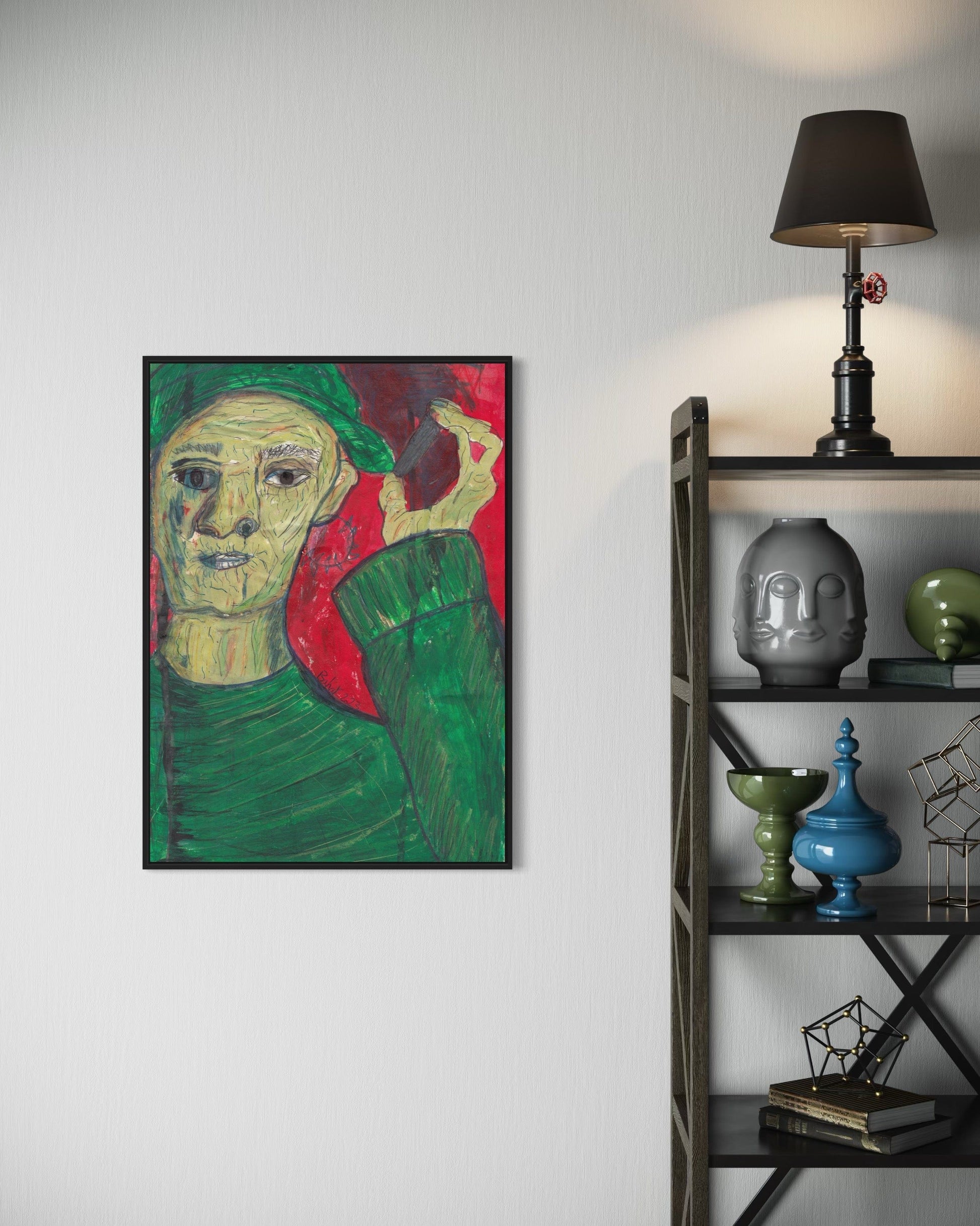 Framed artwork on a wall next to a shelf with decorative items