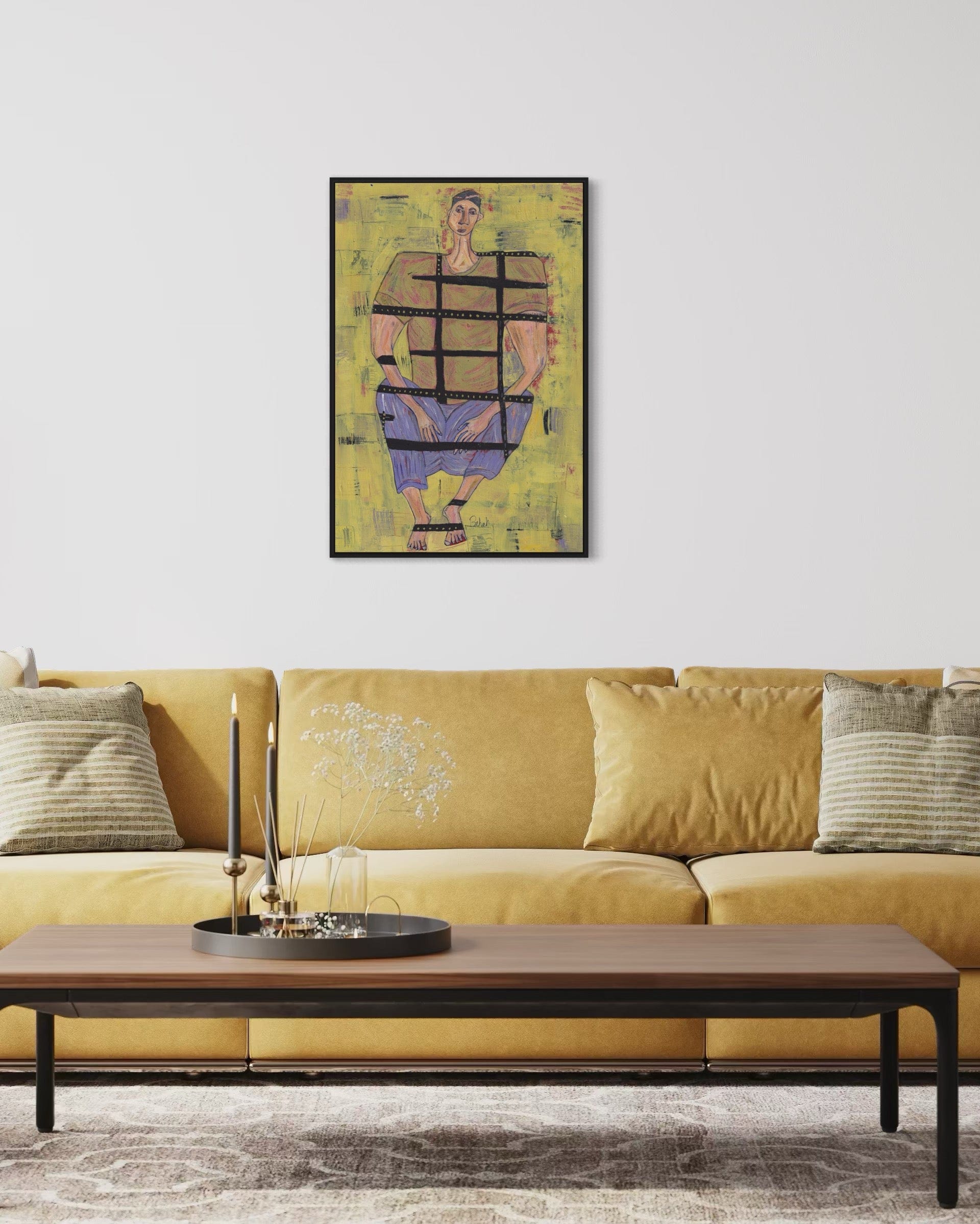 Yellow sofa with a coffee table and abstract painting on the wall