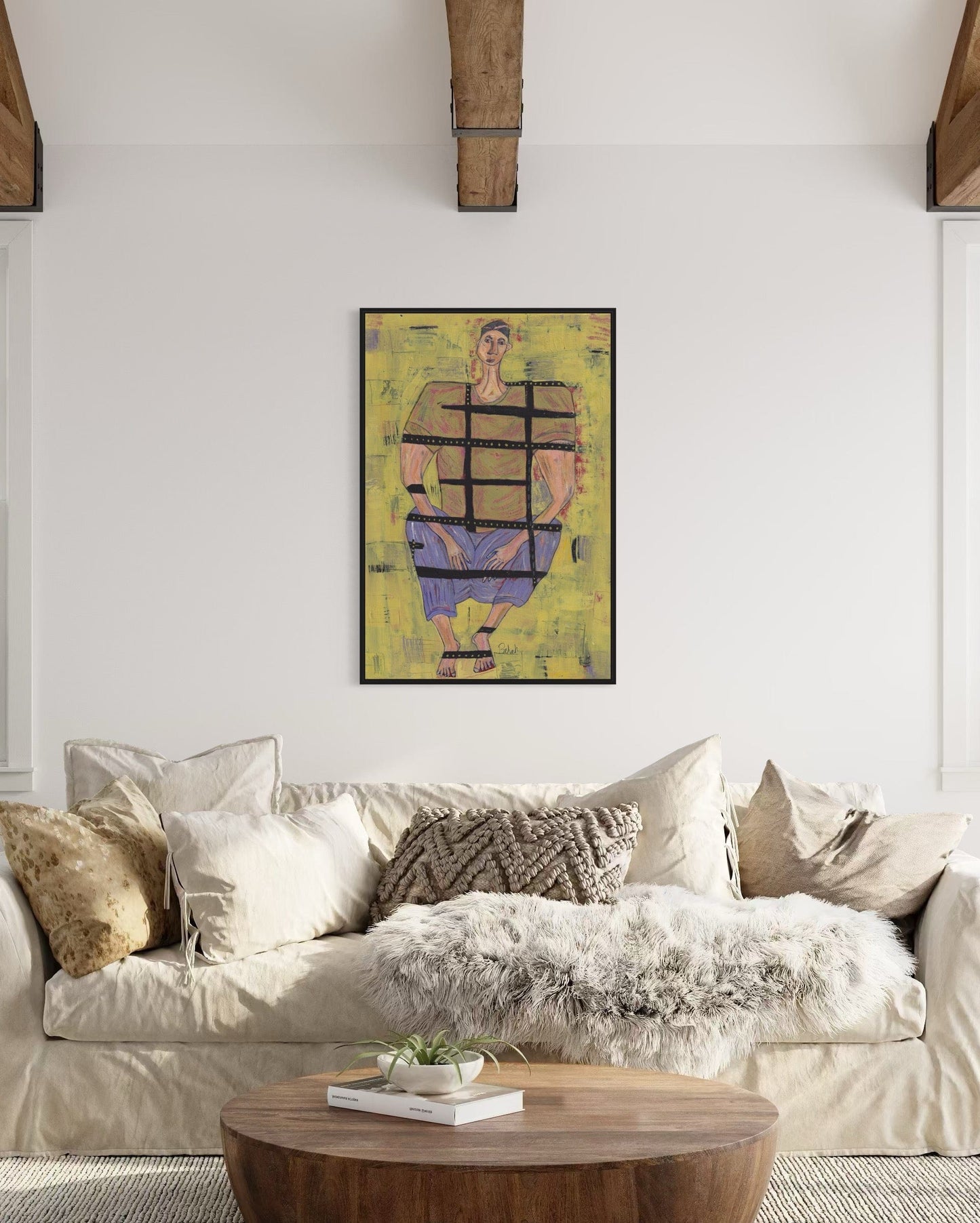 Living room with a beige sofa, wooden coffee table, and abstract painting on the wall.