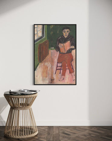 Framed painting of a person sitting on a chair in a room with a wicker side table below.