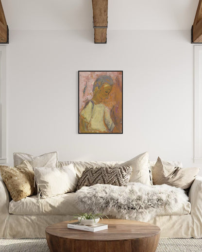 Living room with a beige sofa, wooden coffee table, and framed artwork on the wall.
