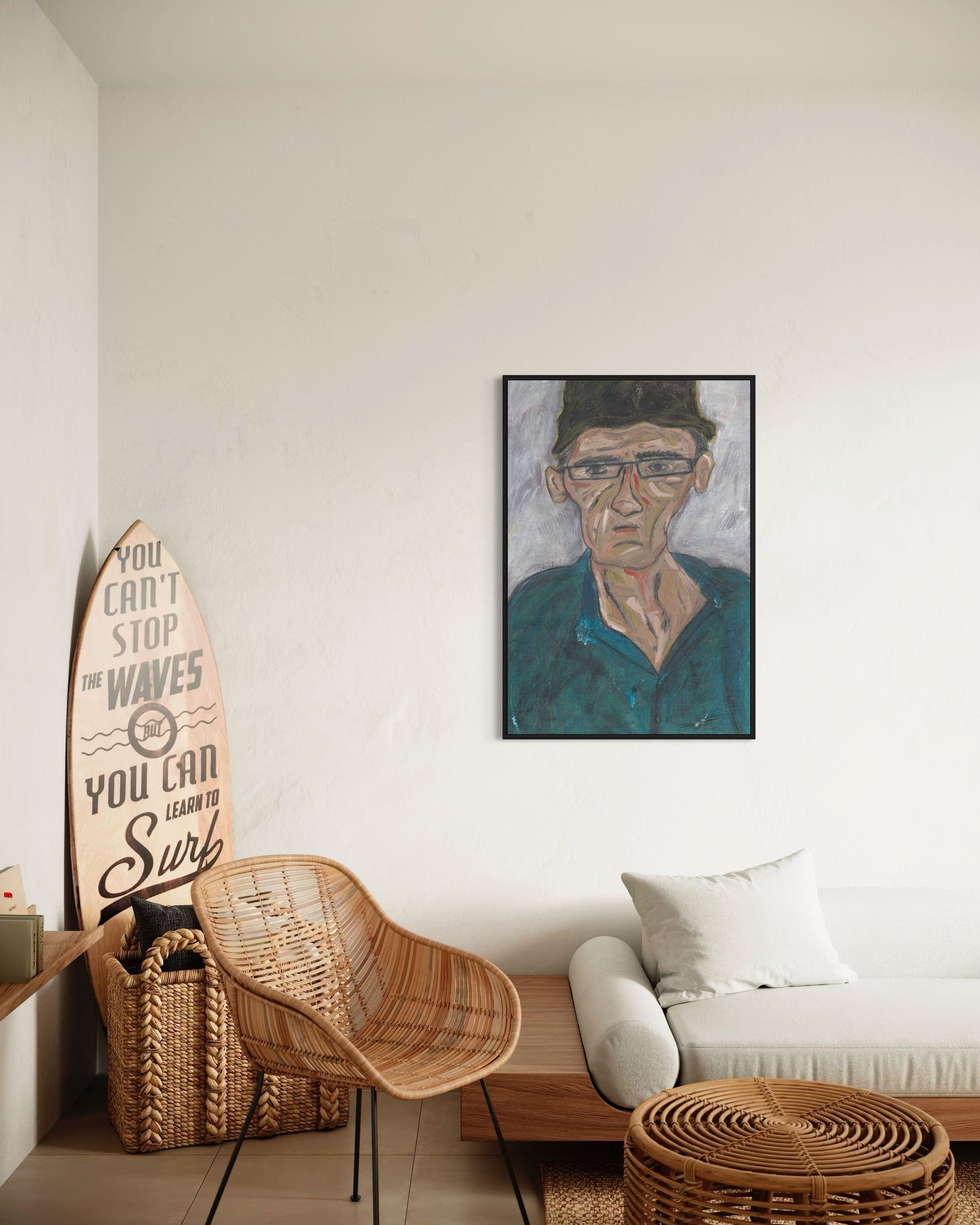 Living room with a surfboard, wicker chair, and framed portrait on the wall.
