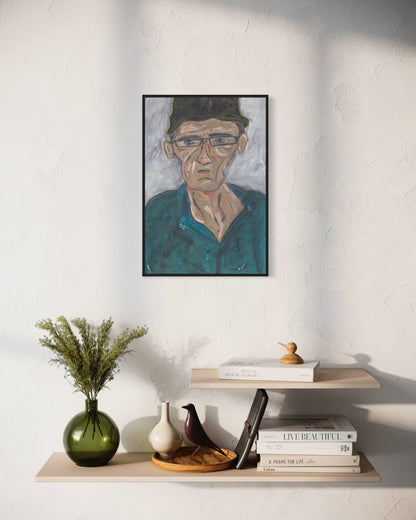 Framed portrait on a wall above a shelf with decorative items