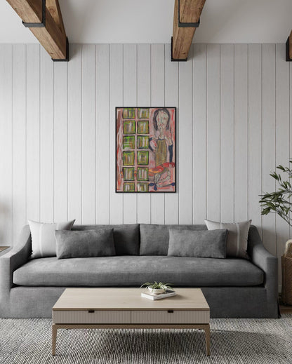 Gray sofa in a living room with a colorful painting on the wall.