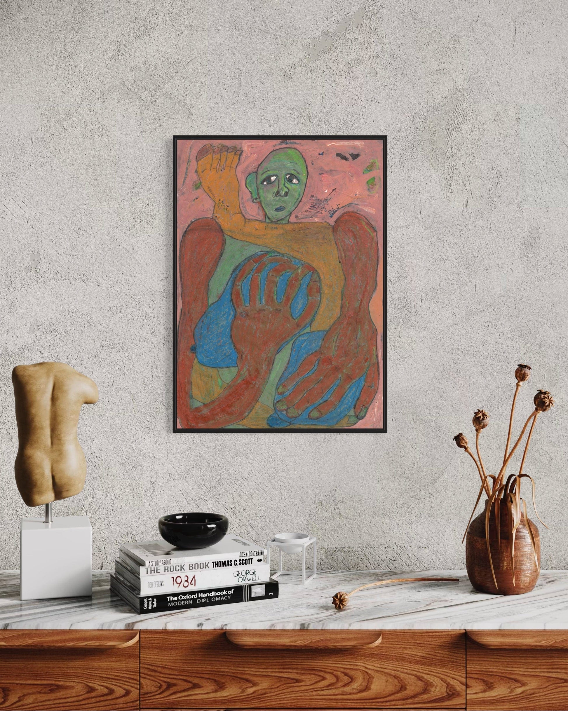 Colorful abstract painting on a wall above a wooden shelf with decorative items.