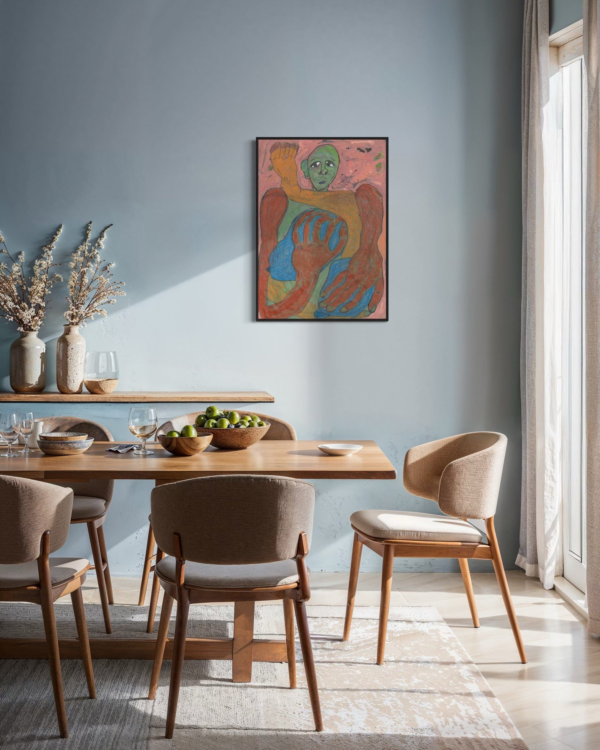 Dining room with wooden table and chairs, colorful abstract painting on wall, and natural light.