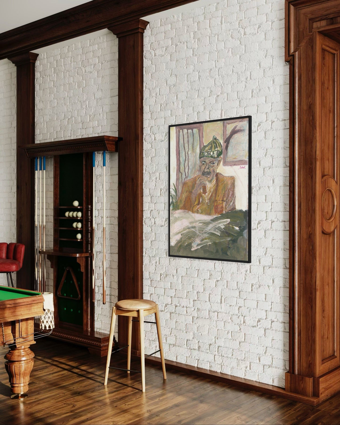 Room interior with a pool table, wooden cabinet, and framed artwork on a white brick wall.