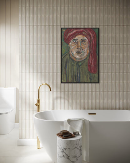 Bathroom interior with a freestanding bathtub, gold faucet, and wall art of a man with a red turban.