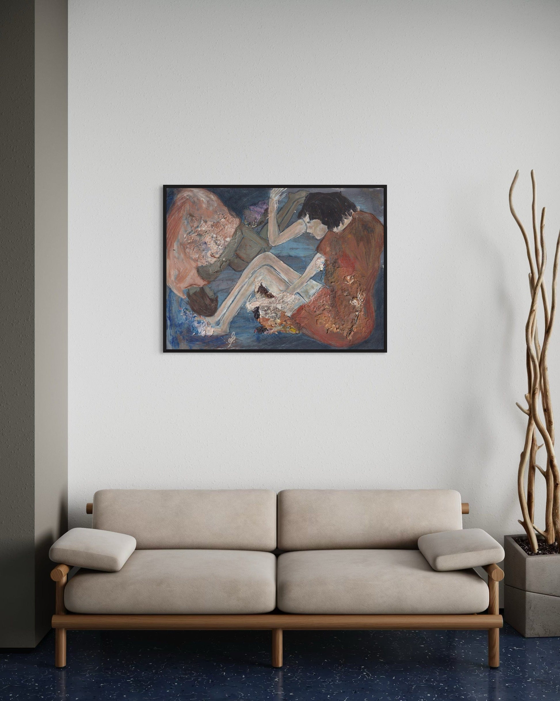 Beige sofa in a room with a painting on the wall and a plant.