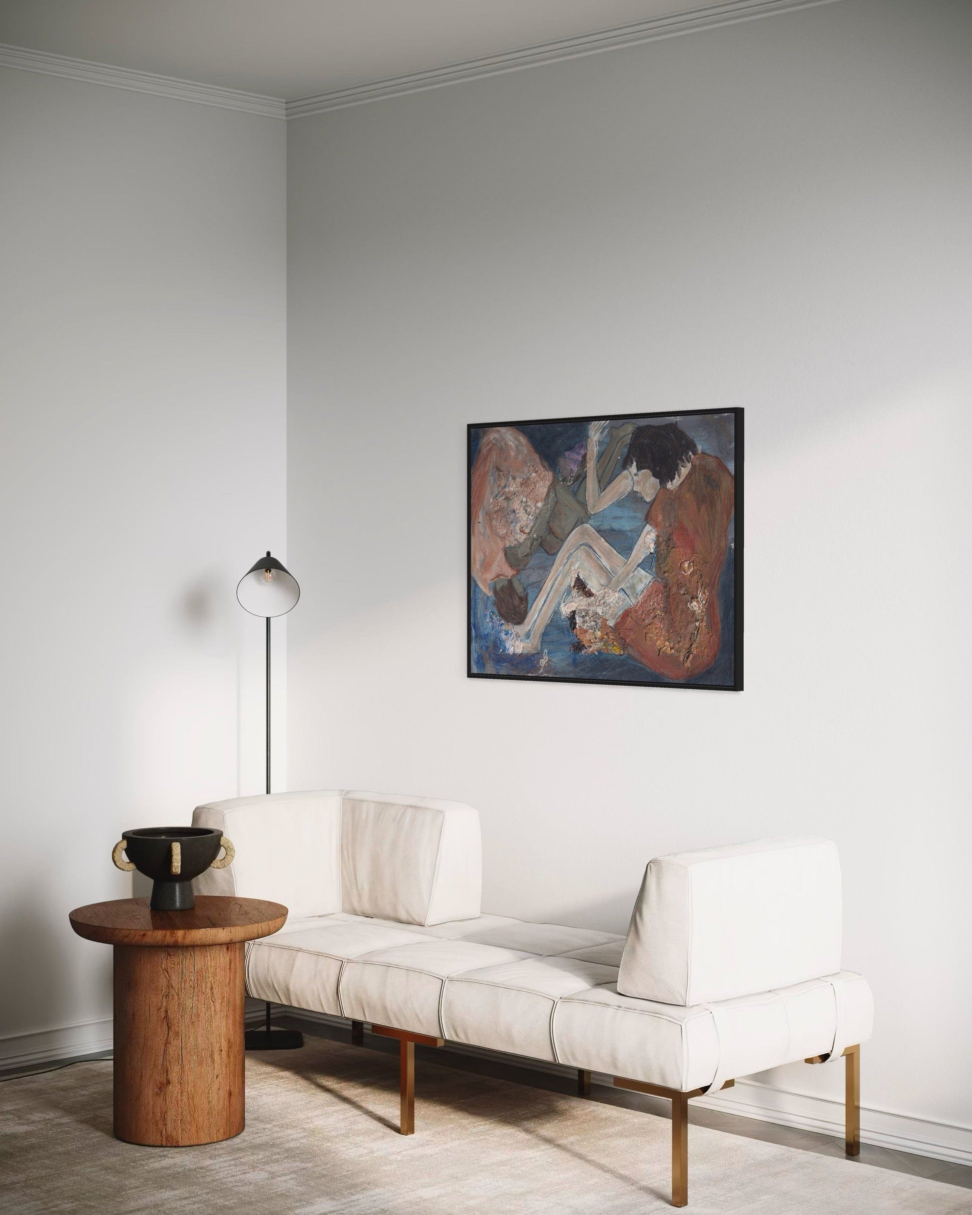 Modern living room with a white sofa, wooden side table, and abstract painting on the wall.