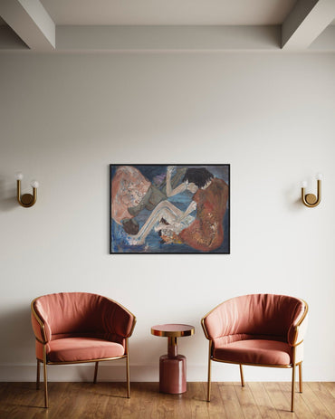 Two pink chairs with gold frames in a room with a painting on the wall.