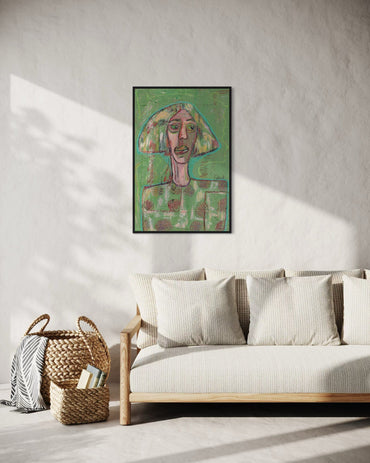 Framed artwork on a wall above a sofa in a living room