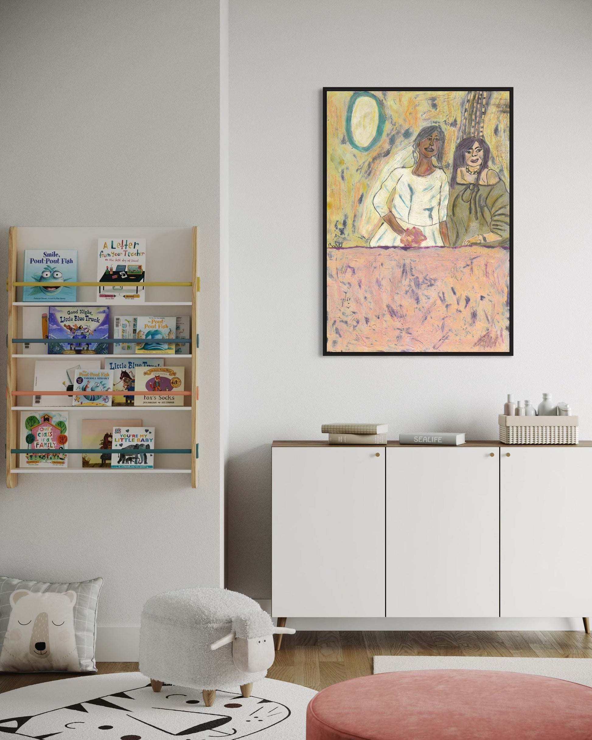 Children's room with bookshelf, cabinet, and wall art