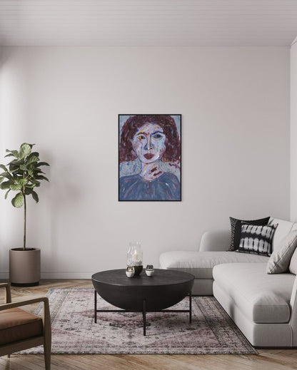 Living room with a modern sofa, coffee table, and artwork on the wall.