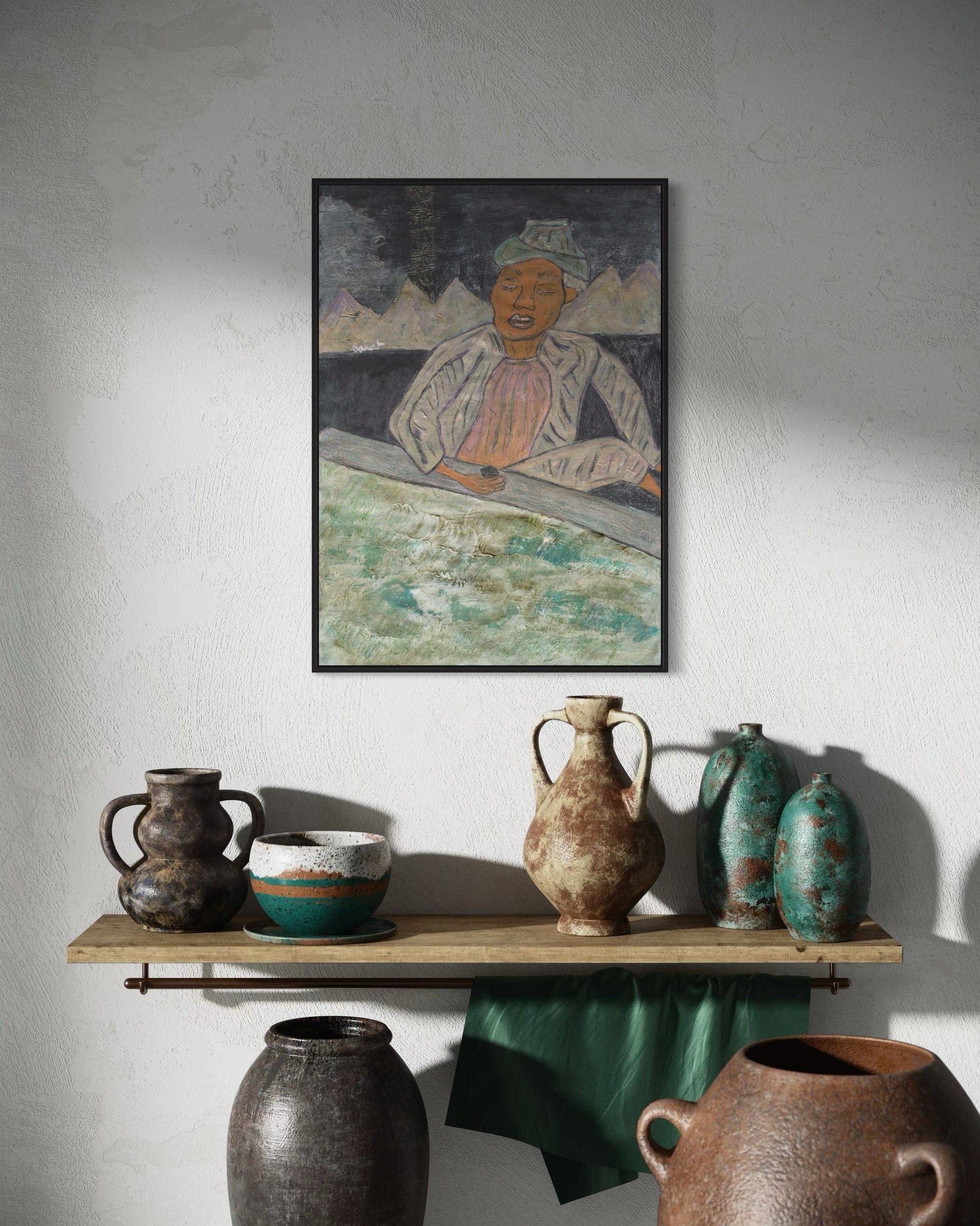 Artistic depiction of a person with mountains, displayed above a shelf with various ceramic pots.