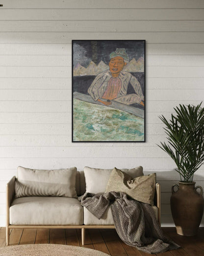 Living room with a beige sofa, decorative pillows, and a framed artwork on the wall.