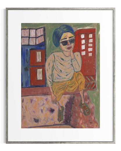 Framed artwork of a person sitting on a wall with colorful buildings in the background