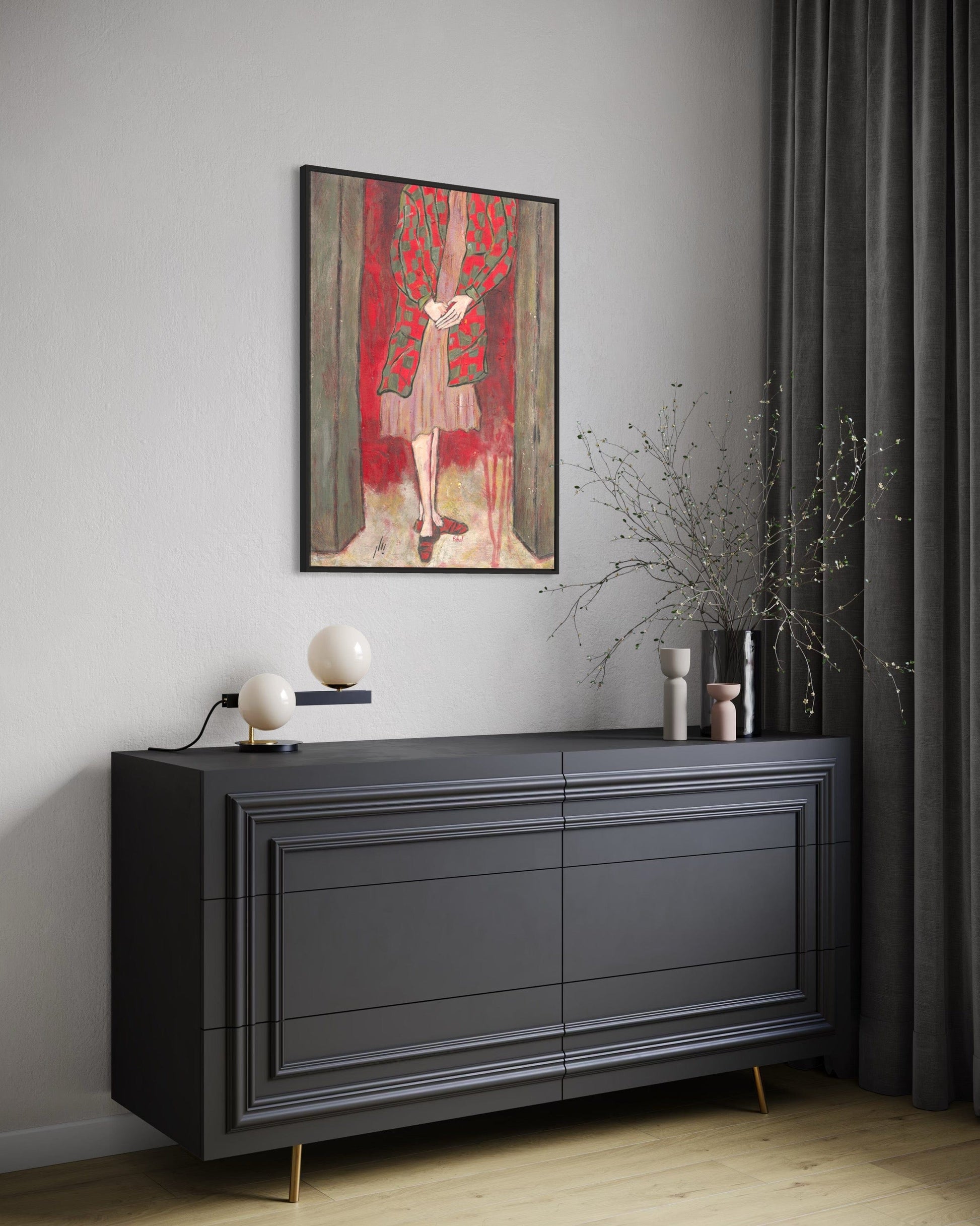Modern interior with a dark gray sideboard, abstract art, and decorative items.