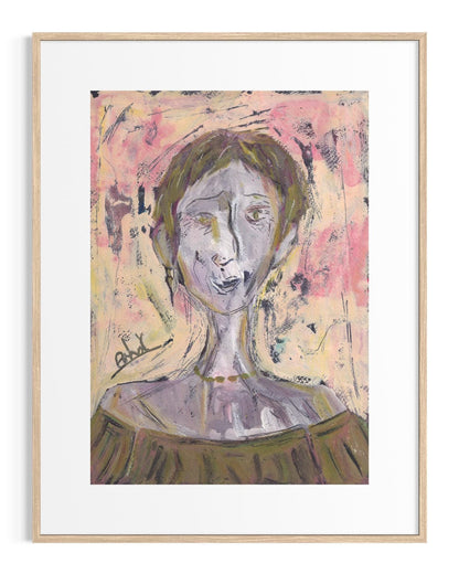 Framed abstract artwork of a woman's face with a colorful background