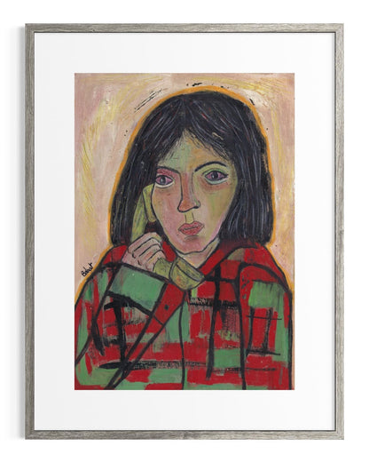 Framed artwork of a person wearing a red and green checkered shirt.