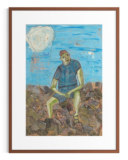 Framed artwork of a person sitting on rocks with a blue sky and moon in the background.