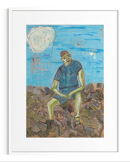 Framed artwork of a person sitting on rocks with a blue sky and moon in the background.