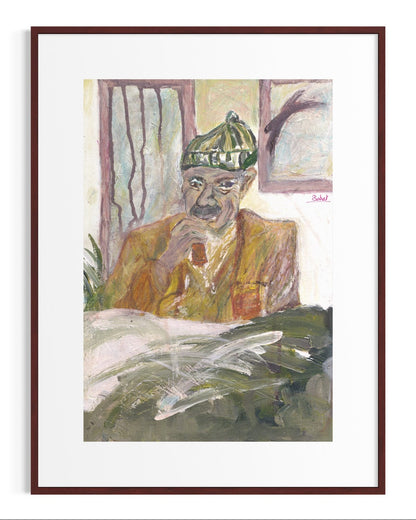 Framed artwork of a man wearing a green cap and sitting at a desk.